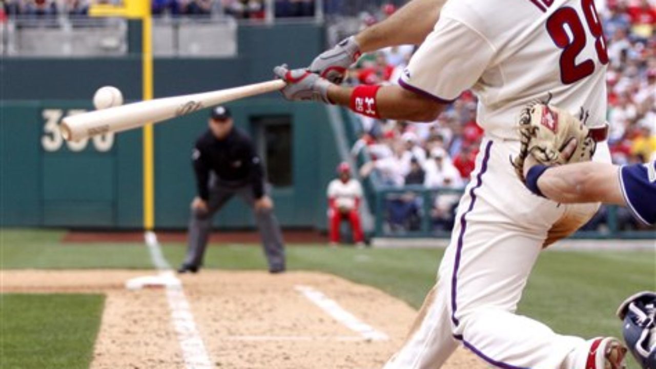 Philadelphia Phillies left fielder Raul Ibanez warms up at Coors