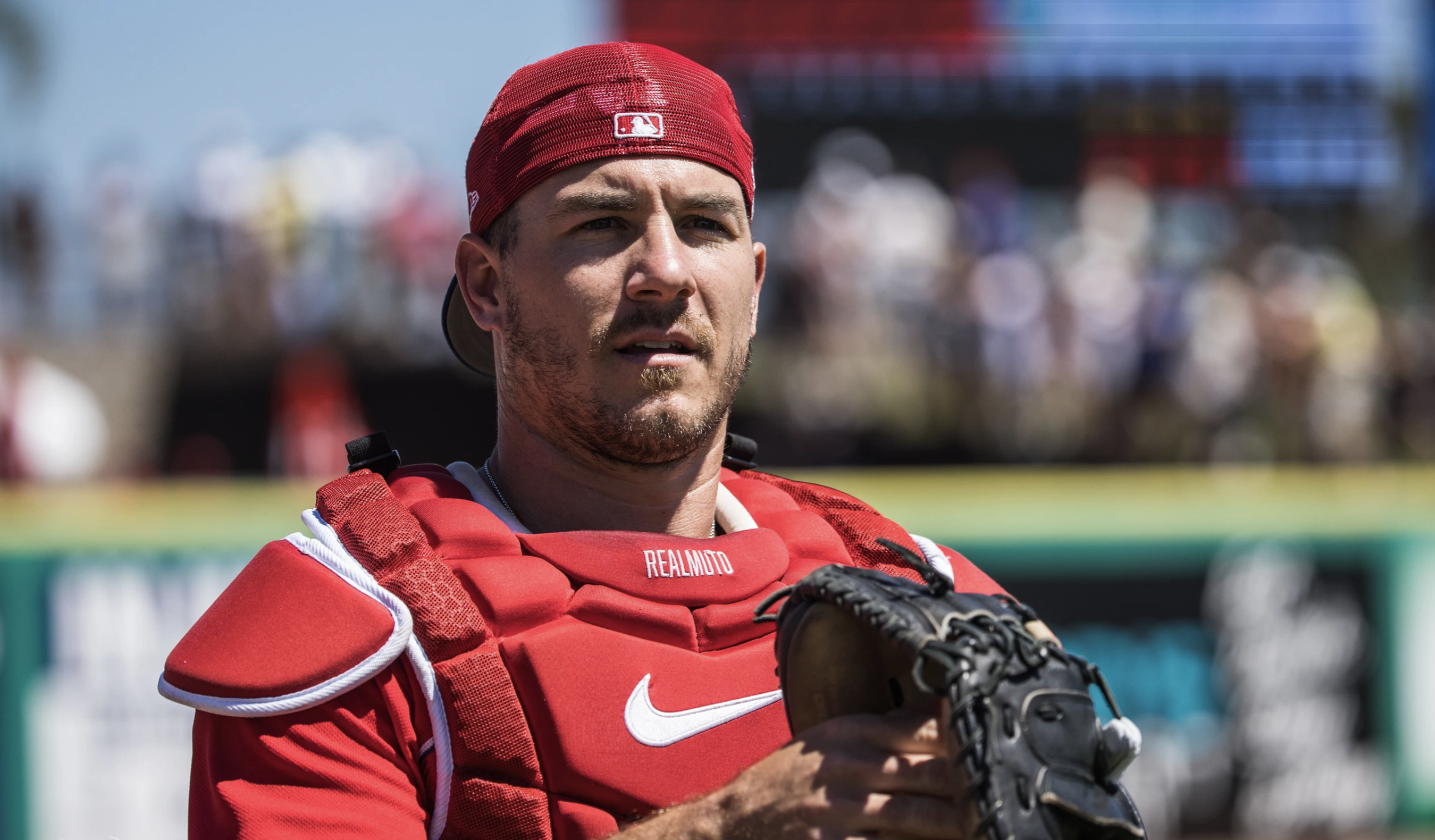 PHILS JT REALMUTO CATCHES IN SPRING TRAINING WEARING A CAST